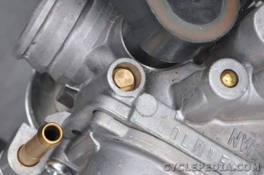 Why is it Important to Check the Pilot Screw when Cleaning the Carburetor?